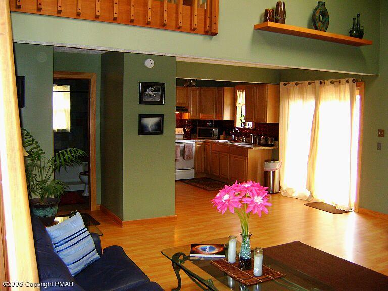 112 Bromley Road Henryville, PA 18332 - Photo 6 of 13 a living room with furniture and flowers