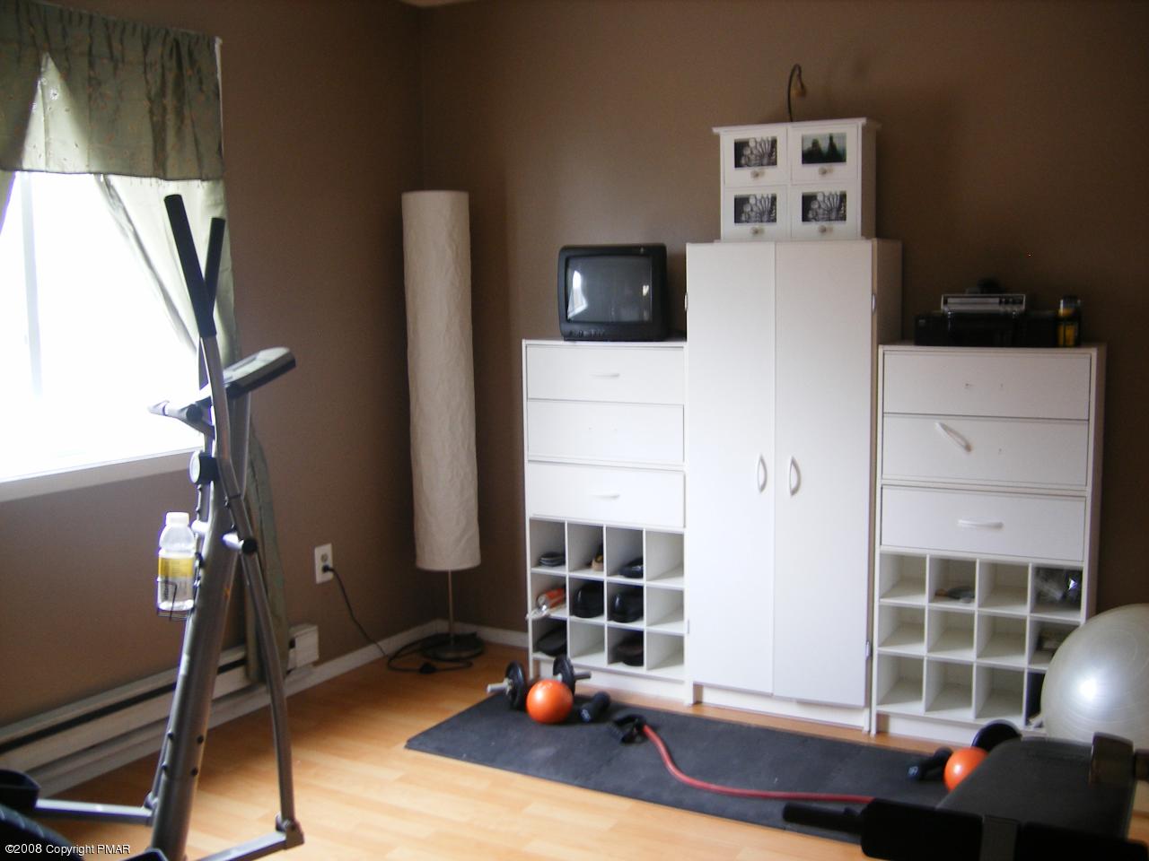 112 Bromley Road Henryville, PA 18332 - Photo 9 of 13 a living room with furniture and a flat screen tv