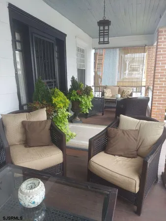 a bedroom with a bed couch and window