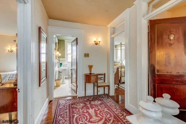a bedroom with furniture and a rug