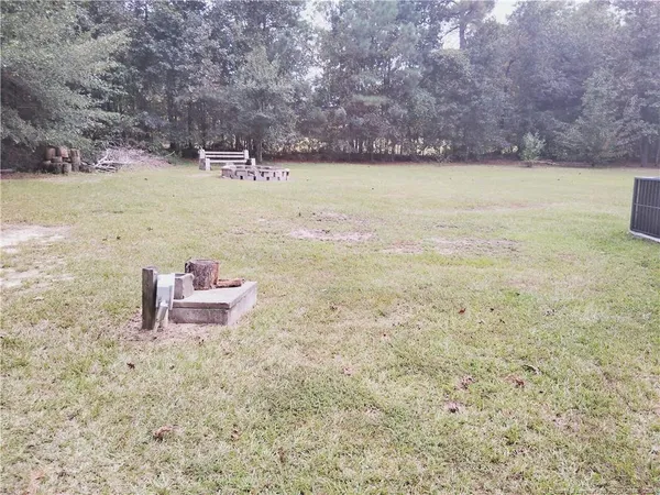 a view of a lake with a yard