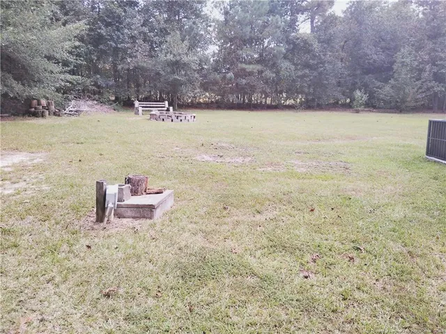 a view of a lake with a yard