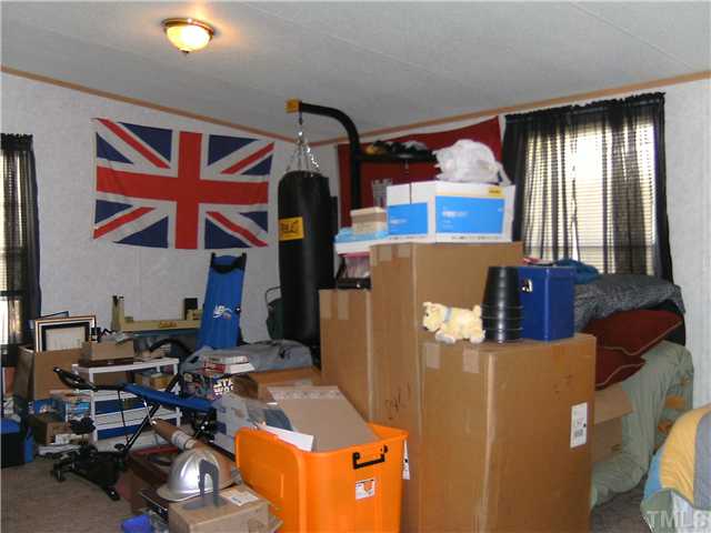 460 Club Pond Road Henderson, NC 27537 - Photo 11 of 14 Spare bedroom used for storage.