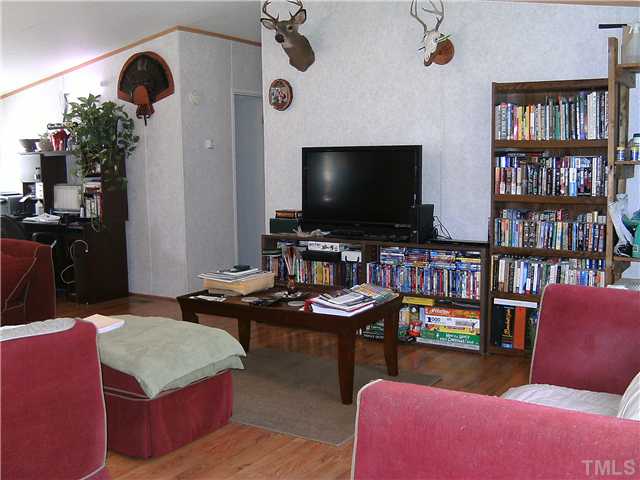 460 Club Pond Road Henderson, NC 27537 - Photo 3 of 14 Living Room with laminate floor
