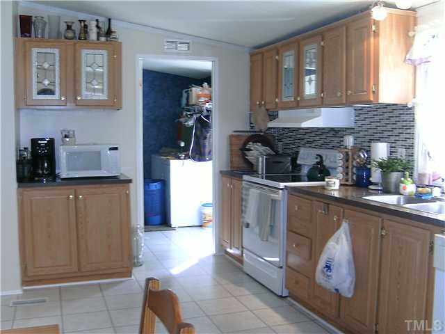 460 Club Pond Road Henderson, NC 27537 - Photo 5 of 14 Kitchen with all appliances. Laundry room between kitchen and master bath.