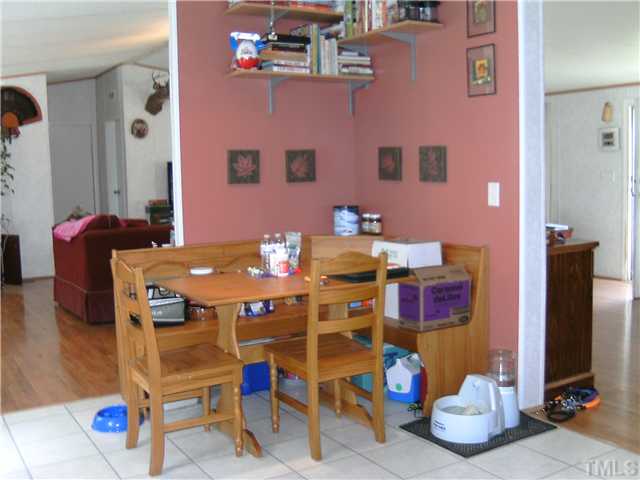 460 Club Pond Road Henderson, NC 27537 - Photo 6 of 14 Breakfast area in kitchen with laminate tile floors.