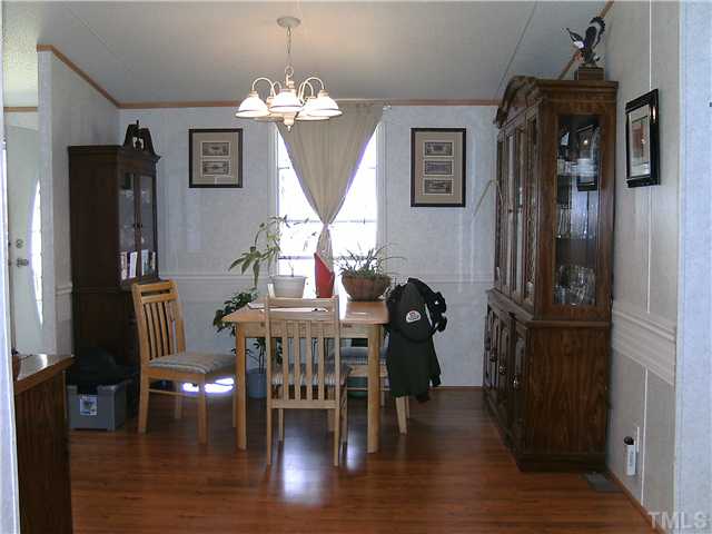 460 Club Pond Road Henderson, NC 27537 - Photo 7 of 14 Dining room with laminate floor.