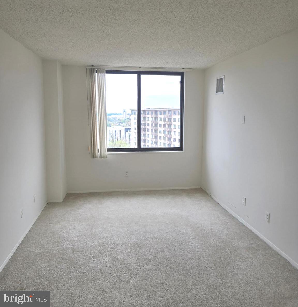 5225 Pooks Hill Road, Unit 1814N Bethesda, MD 20814 - Photo 17 of 52 an empty room with a window
