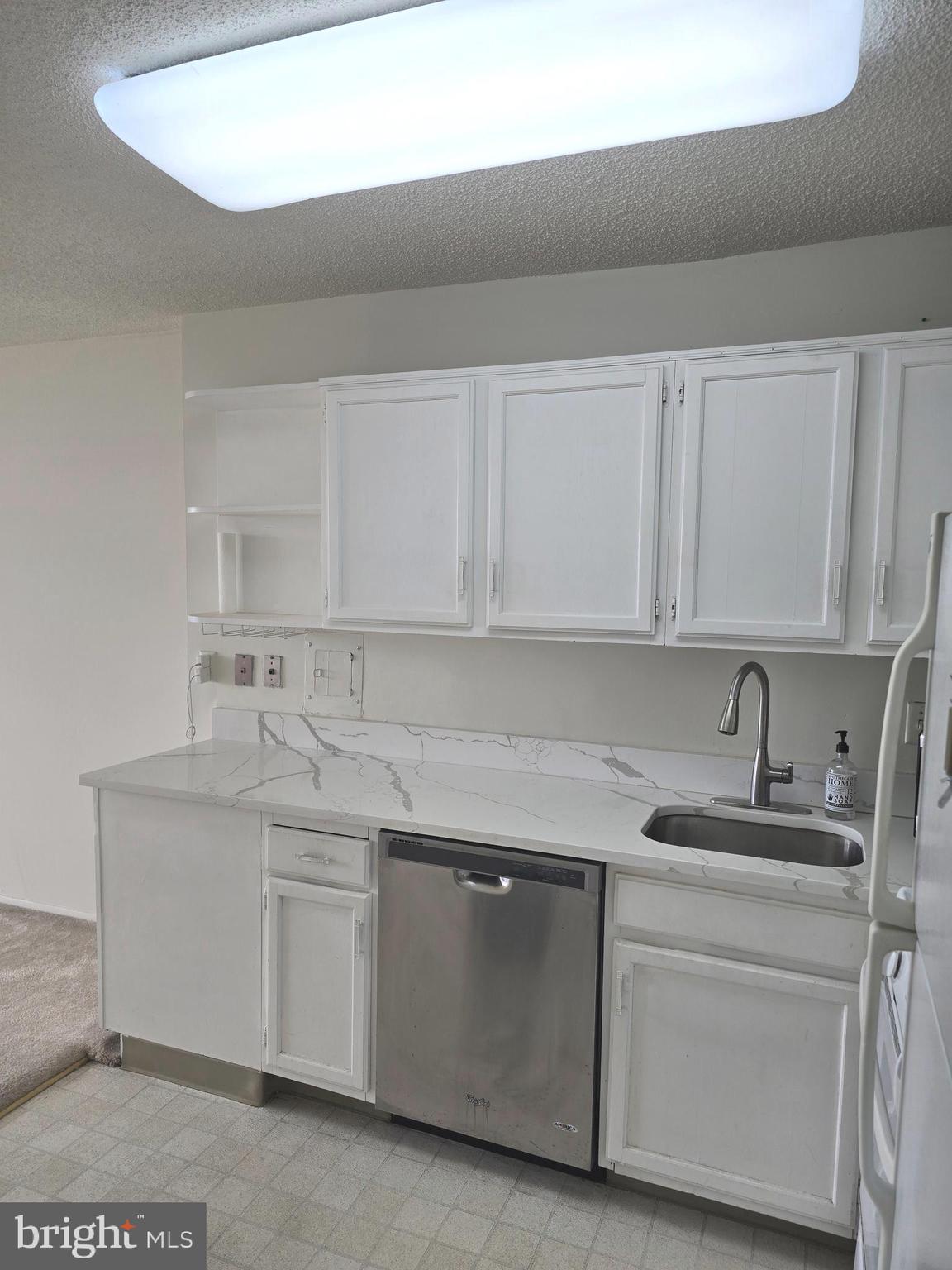 5225 Pooks Hill Road, Unit 1814N Bethesda, MD 20814 - Photo 30 of 52 a kitchen with white cabinets