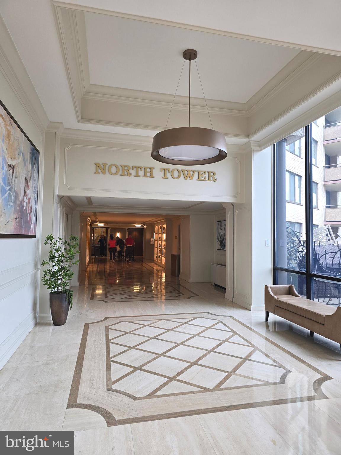 5225 Pooks Hill Road, Unit 1814N Bethesda, MD 20814 - Photo 5 of 52 a view of a lobby with a chandelier and living room