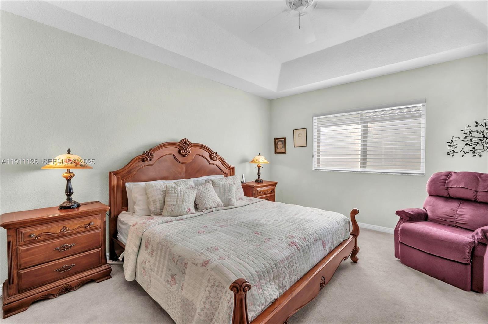 7921 Exeter Boulevard East, Unit 202 Tamarac, FL 33321 - Photo 23 of 55 a bedroom with a bed and a dresser
