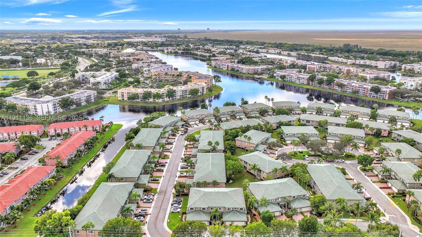 7921 Exeter Boulevard East, Unit 202 Tamarac, FL 33321 - Photo 39 of 55 an aerial view of residential houses with outdoor space