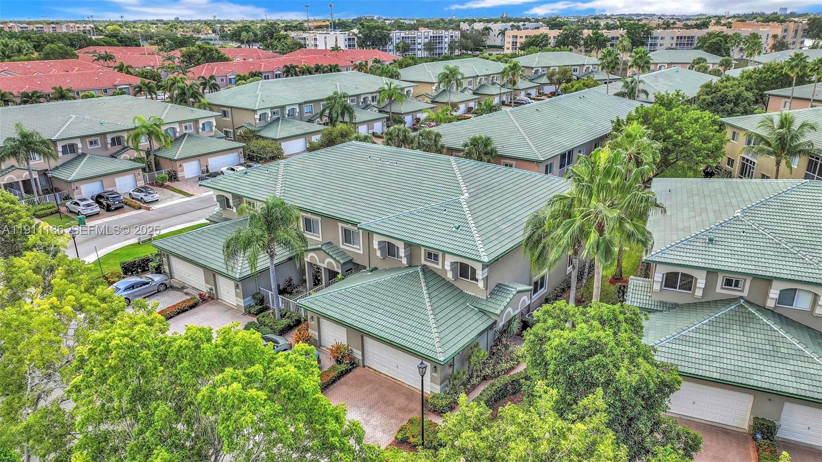 7921 Exeter Boulevard East, Unit 202 Tamarac, FL 33321 - Photo 54 of 55 an aerial view of a house with a garden