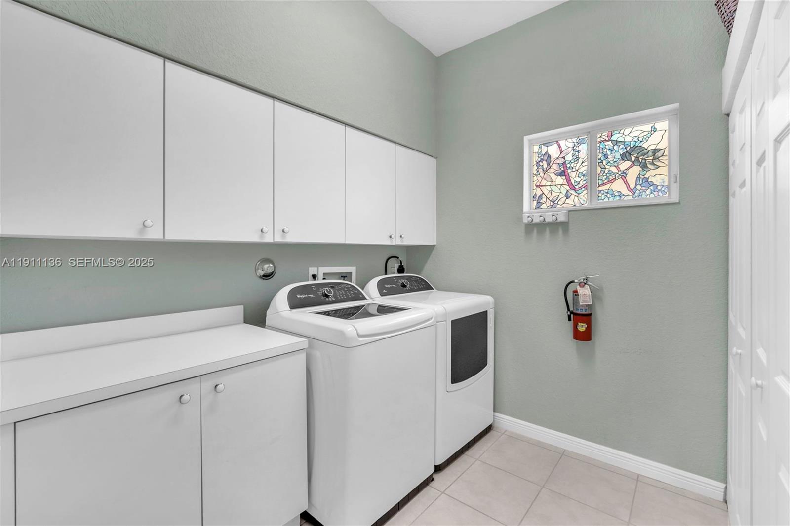 7921 Exeter Boulevard East, Unit 202 Tamarac, FL 33321 - Photo 6 of 55 a utility room with dryer and washer