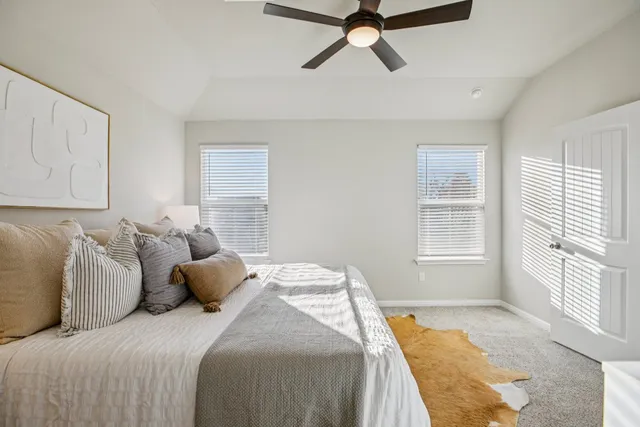 a bed room with a bed and a window