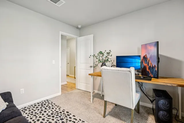 a dining room with furniture and a fireplace