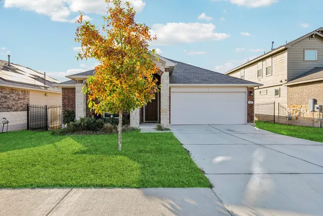 a house view with a garden space