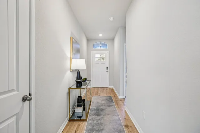 a view of a hallway view with staircase