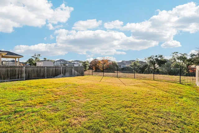 a view of an empty swimming pool and an outdoor space