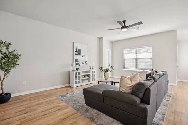 a living room with furniture and a window