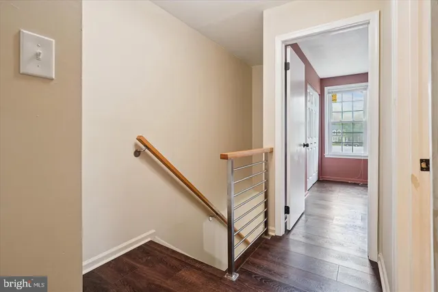 a view of a hallway with stairs
