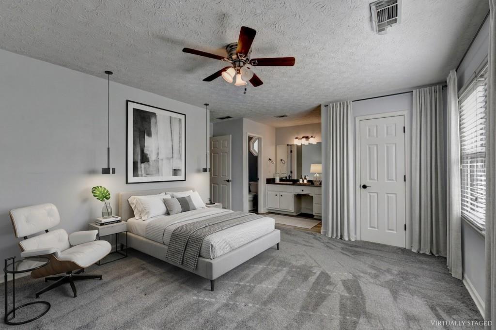 351 Cottonpatch Road Lawrenceville, GA 30046 - Photo 18 of 47 a bedroom with a bed and ceiling fan