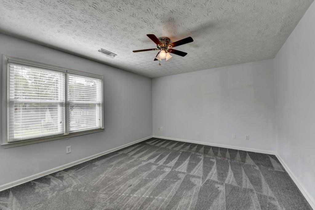 351 Cottonpatch Road Lawrenceville, GA 30046 - Photo 19 of 47 a view of an empty room with a window
