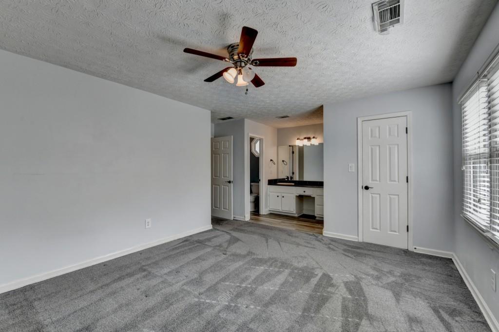 351 Cottonpatch Road Lawrenceville, GA 30046 - Photo 21 of 47 a view of a livingroom with a ceiling fan and window