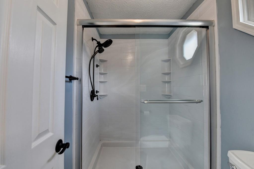 351 Cottonpatch Road Lawrenceville, GA 30046 - Photo 24 of 47 a bathroom with a shower