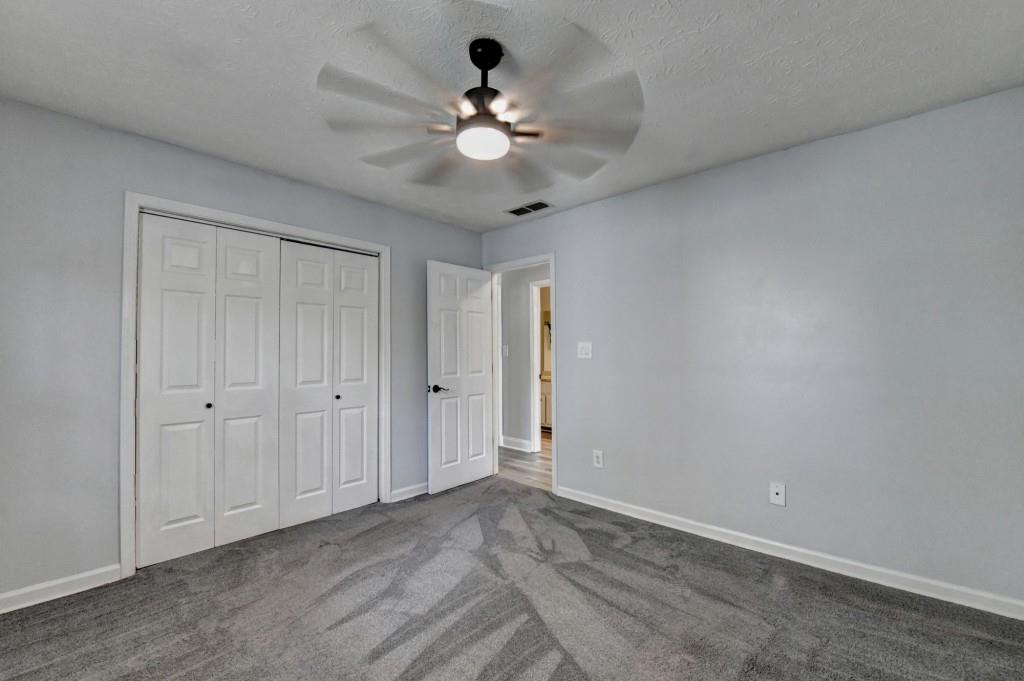 351 Cottonpatch Road Lawrenceville, GA 30046 - Photo 28 of 47 a view of an empty room and a ceiling fan window
