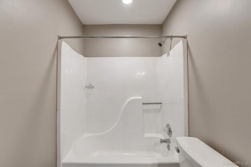 351 Cottonpatch Road Lawrenceville, GA 30046 - Photo 29 of 47 a bathroom with a white bath tub and a shower