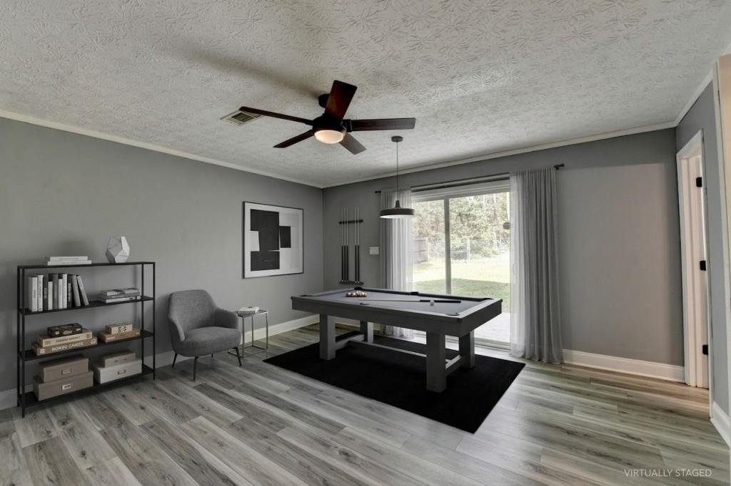 351 Cottonpatch Road Lawrenceville, GA 30046 - Photo 34 of 47 a living room with furniture and a wooden floor