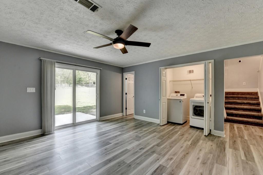 351 Cottonpatch Road Lawrenceville, GA 30046 - Photo 36 of 47 a view of empty room with wooden floor and window