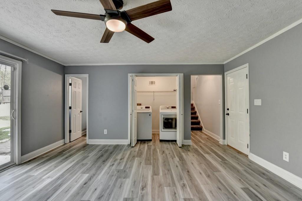351 Cottonpatch Road Lawrenceville, GA 30046 - Photo 37 of 47 wooden floor in an empty room with a window