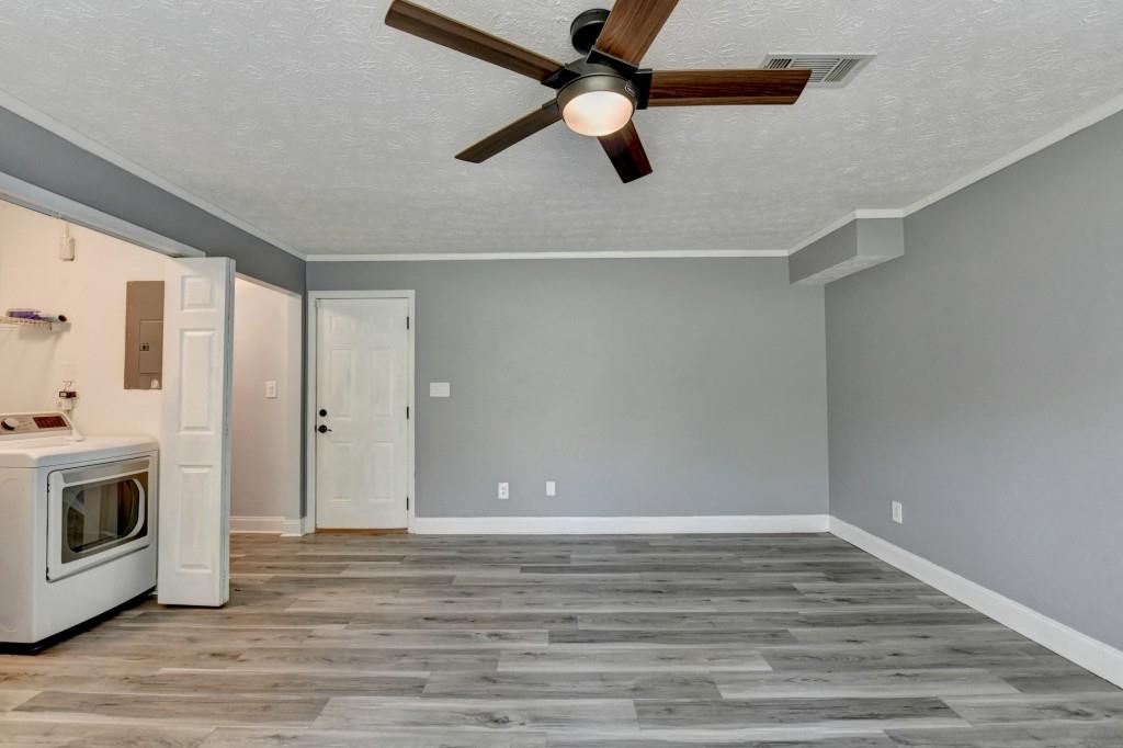 351 Cottonpatch Road Lawrenceville, GA 30046 - Photo 38 of 47 a view of empty room with wooden floor and fan