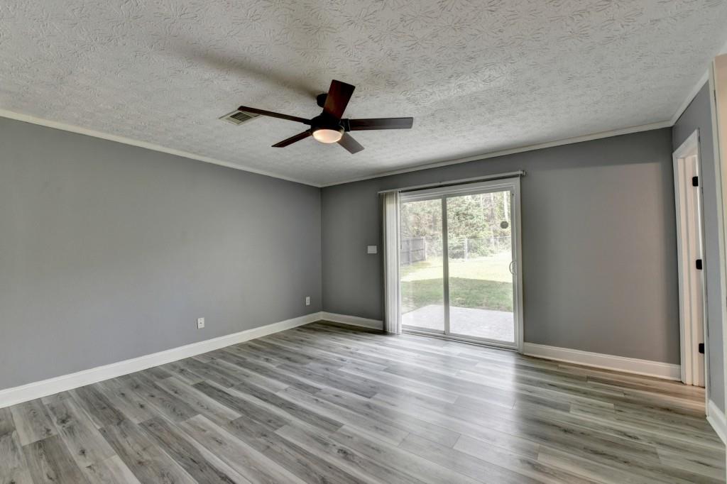 351 Cottonpatch Road Lawrenceville, GA 30046 - Photo 39 of 47 a view of empty room with wooden floor and fan