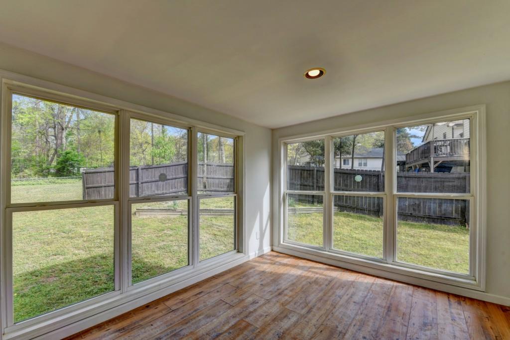 351 Cottonpatch Road Lawrenceville, GA 30046 - Photo 45 of 47 a view of empty room with wooden floor and fan