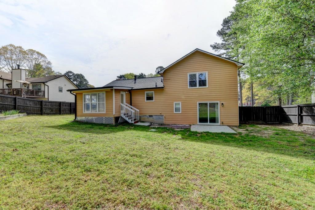 351 Cottonpatch Road Lawrenceville, GA 30046 - Photo 46 of 47 a view of a yard in front of a house with large trees