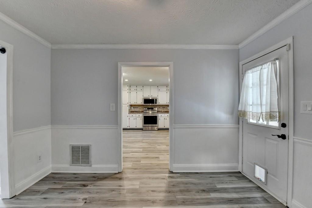 351 Cottonpatch Road Lawrenceville, GA 30046 - Photo 9 of 47 a view of a kitchen cabinets and wooden floor