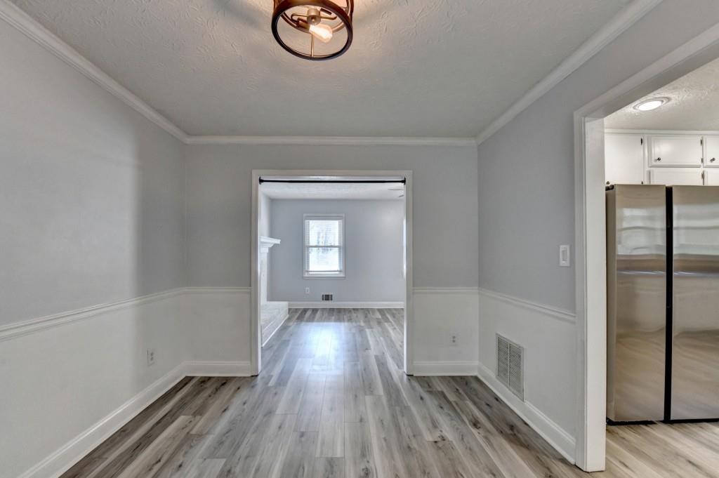 351 Cottonpatch Road Lawrenceville, GA 30046 - Photo 10 of 47 a view of a livingroom with wooden floor