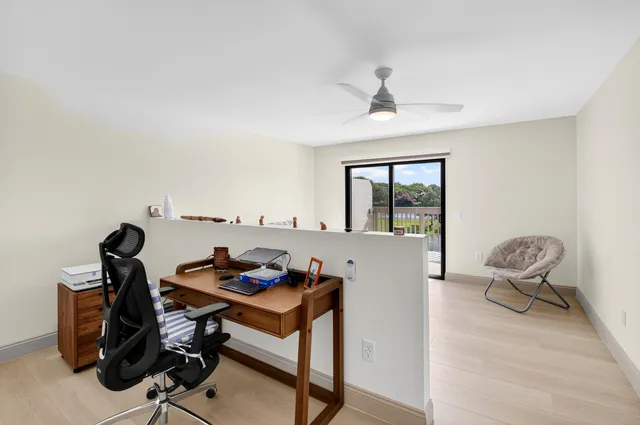 a bedroom with a bed and a table in it