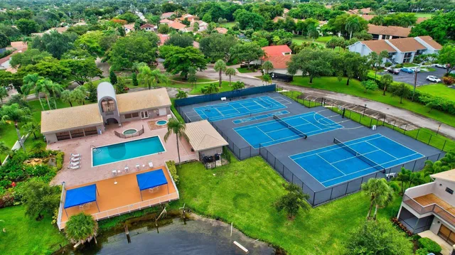 a view of a chairs and table in the balcony