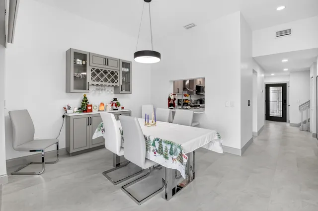 a kitchen with cabinets appliances and a sink