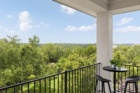 a view of a balcony with an outdoor space