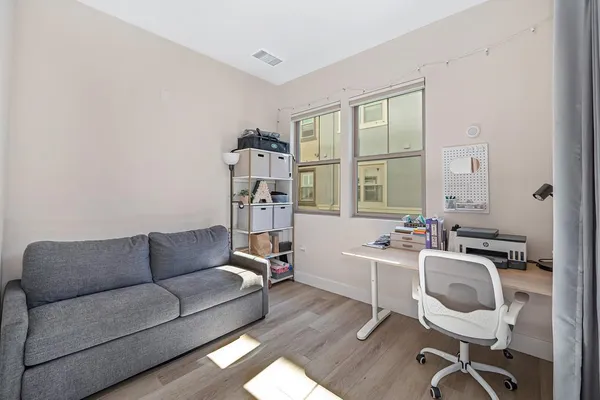 a view of a livingroom with furniture and windows