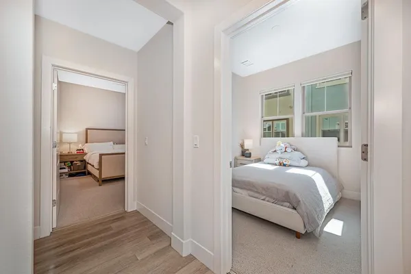 a bedroom with a bed and a ceiling fan
