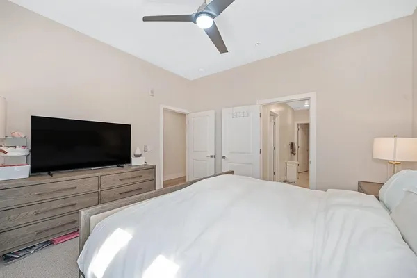 a bathroom with a double vanity sink mirror and toilet