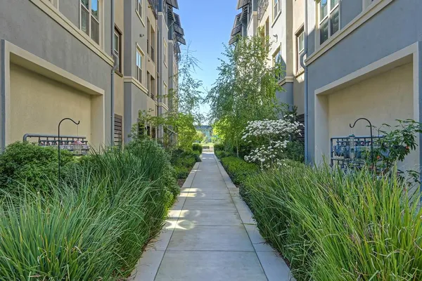 front view of a brick house with a road