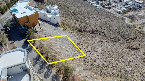 a view of a backyard with chairs