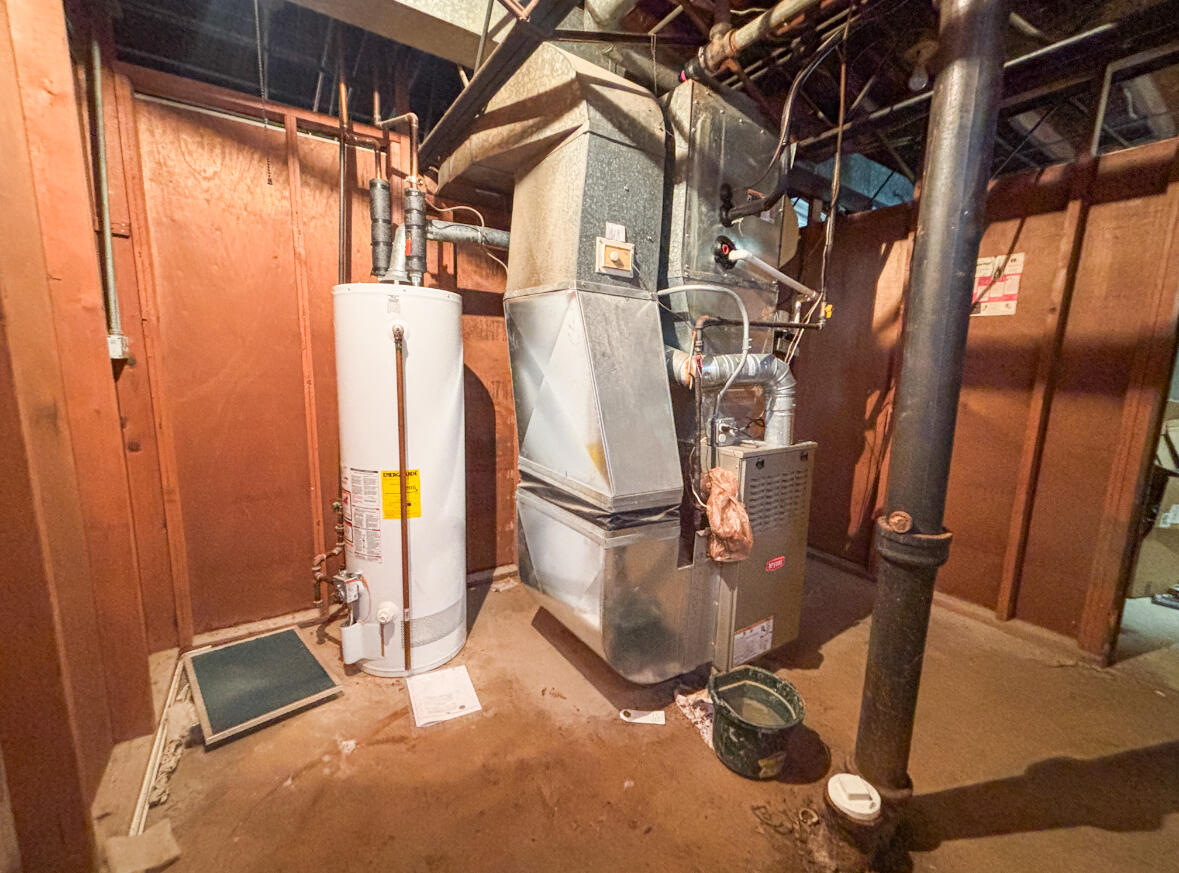 6844 Ridgeland Avenue Hammond, IN 46324 - Photo 18 of 21 a view of a room with water heater and painted walls